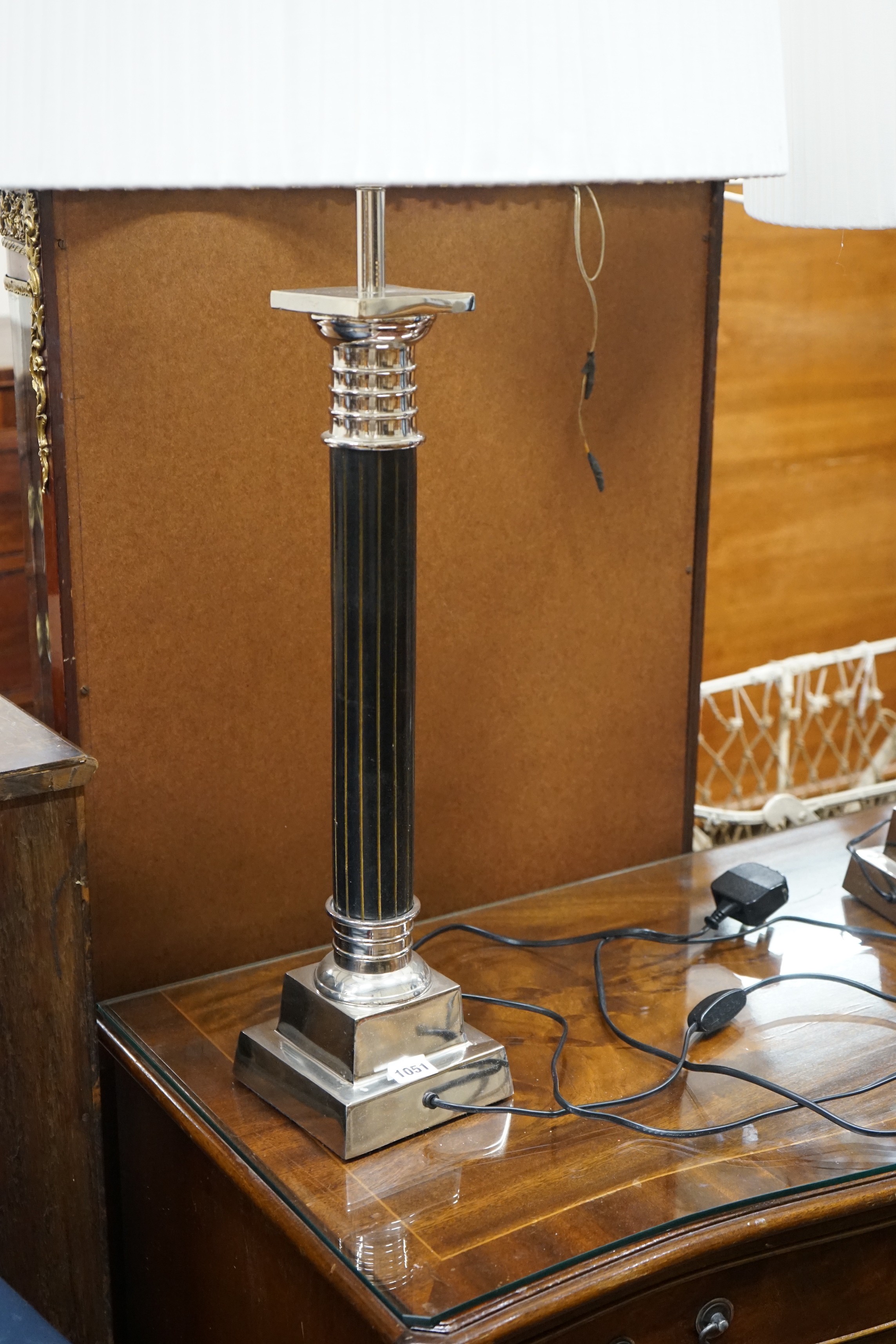 A pair of Oka gilt metal mounted and black lacquer table lamps and shades, height with shades 97cm